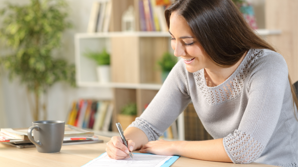 Donor signing an egg donation agreement